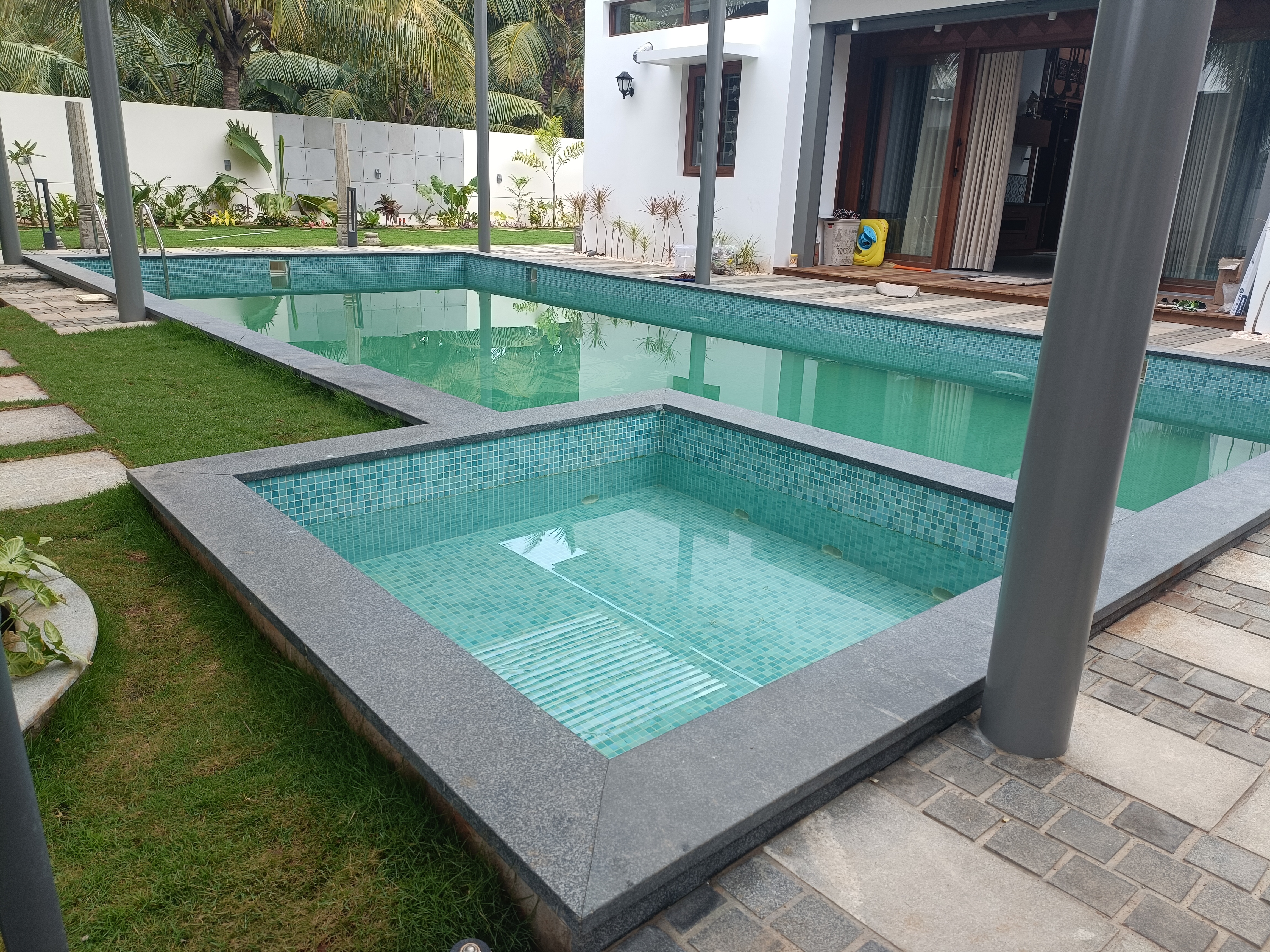 Swimming pool with waterfall